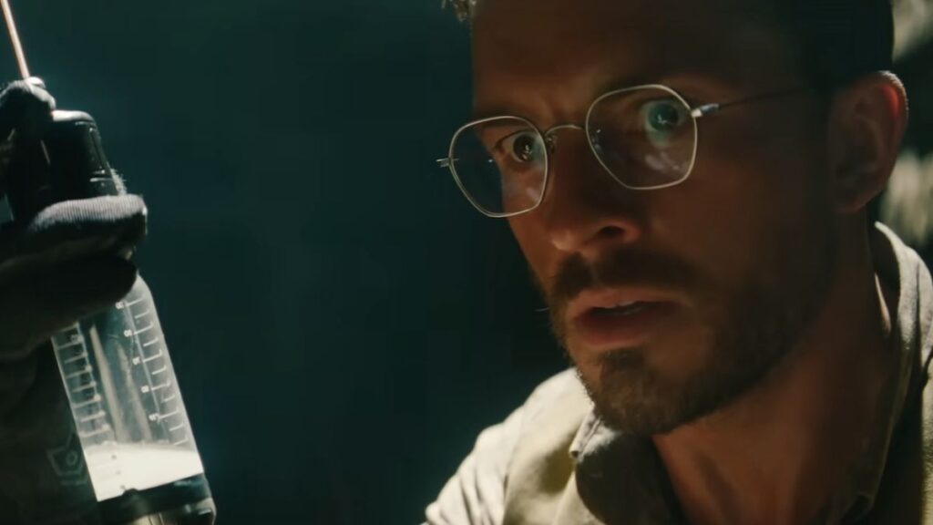 Jonathan Bailey with a needle in Jurassic World: Rebirth