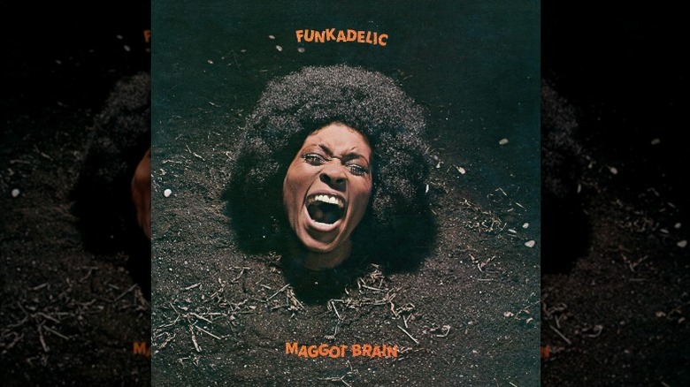 Couverture de Funkadelic de Maggot Brain, représentant la tête hurlante d'une femme dépassant de la boue